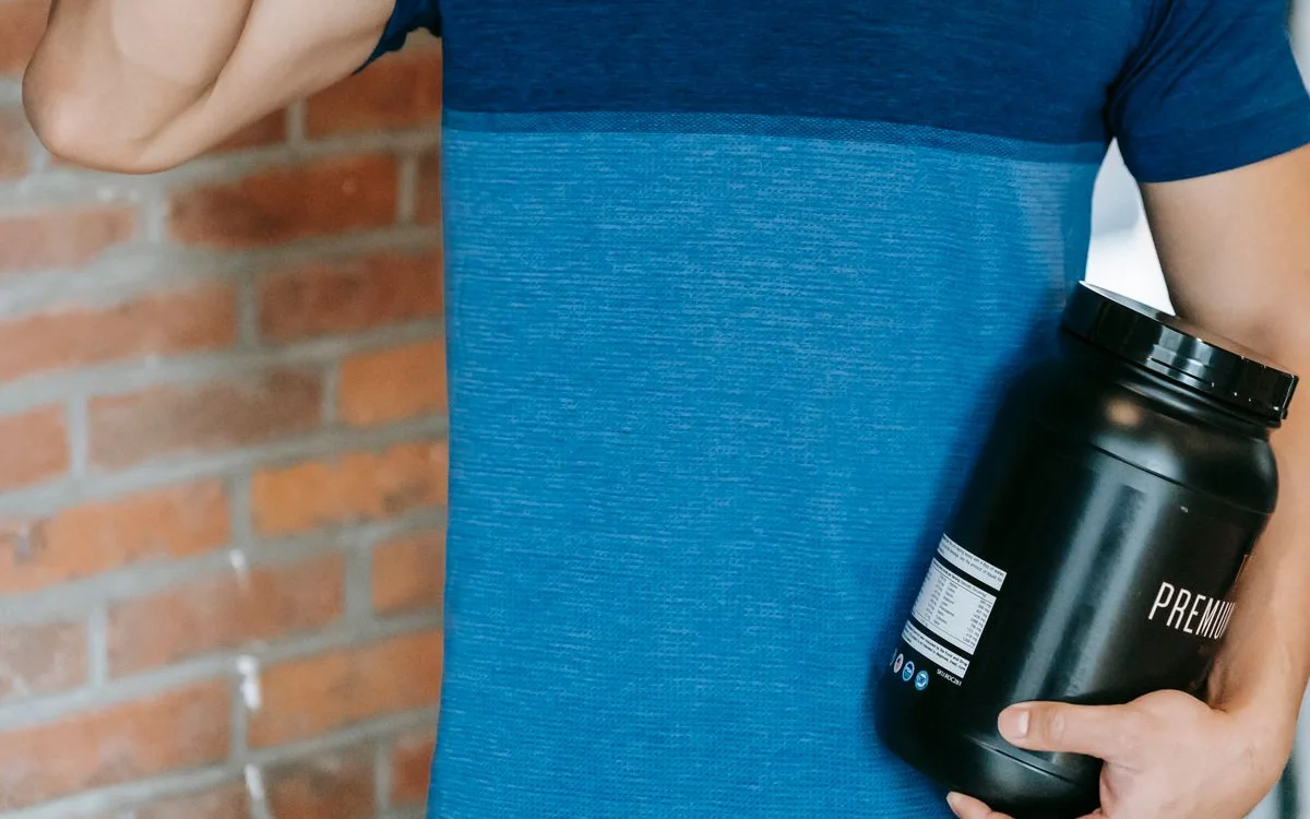 An athlete drinking a protein shake in the gym