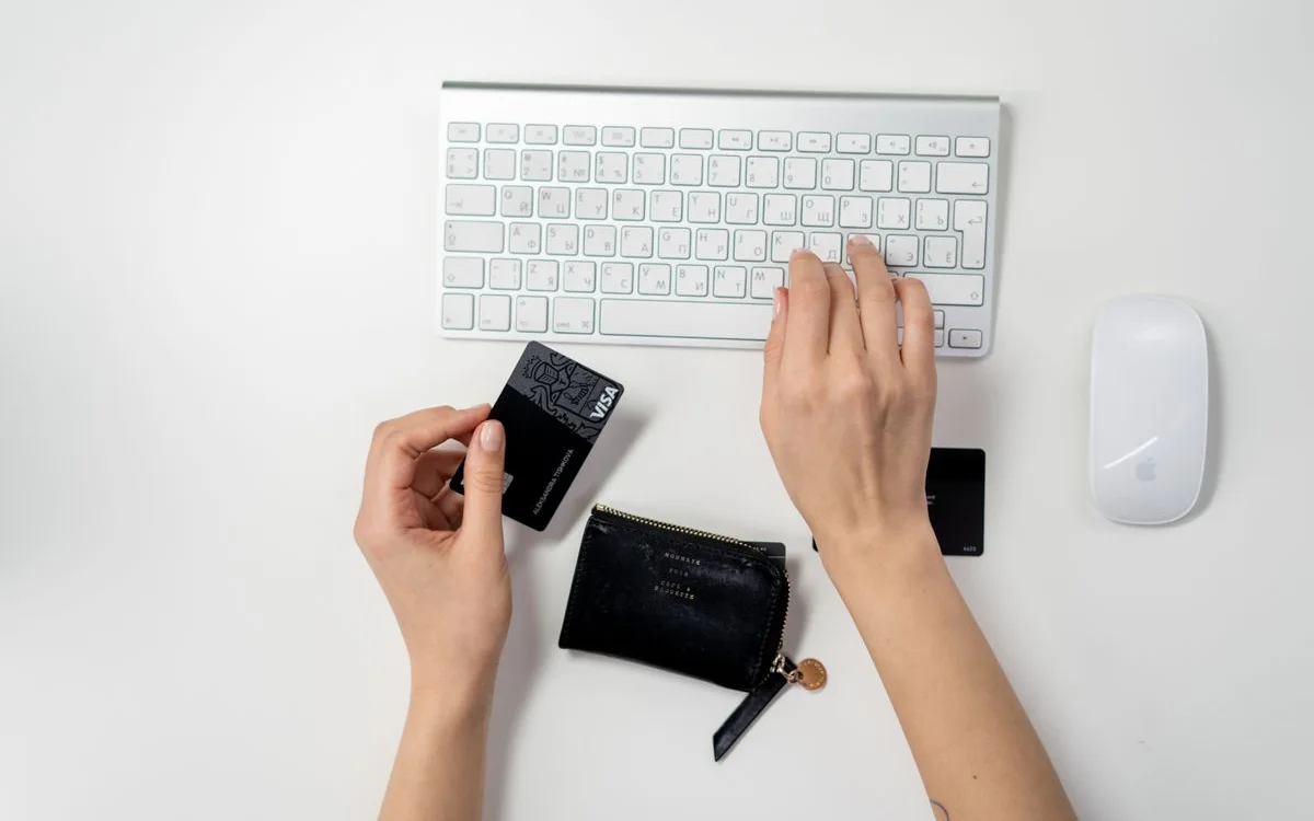 Shopping online with a card and a laptop